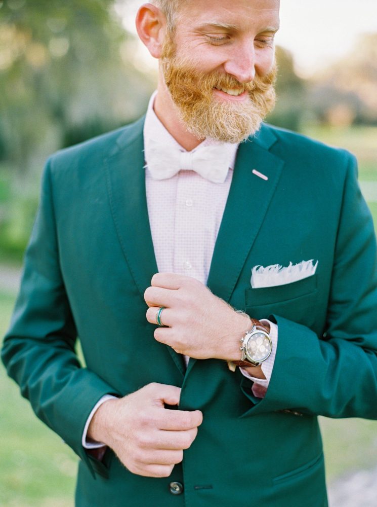 Emerald green tuxedo and white bow tie
