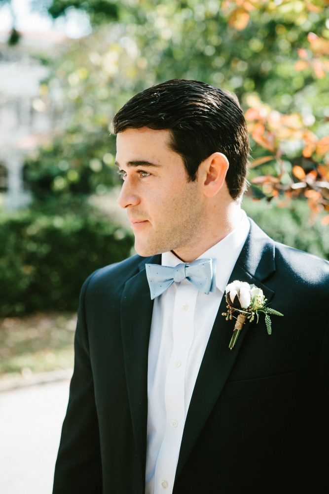 Groom in a baby blue bow tie