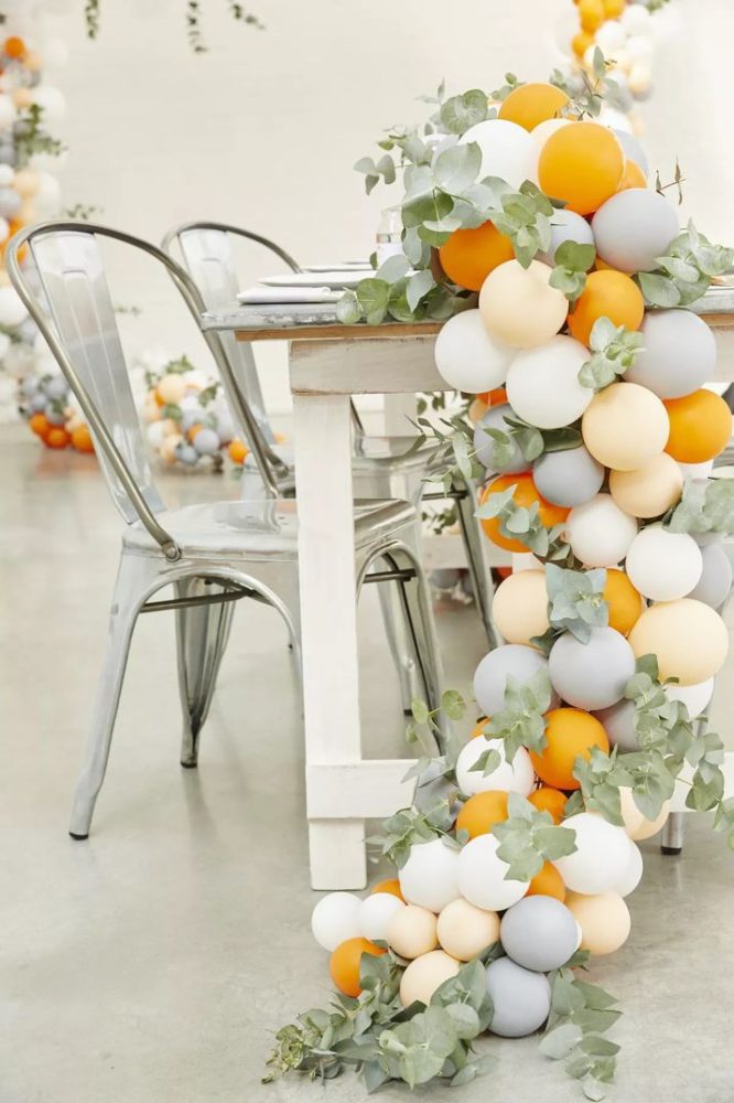 Pastel balloon garland on a reception table