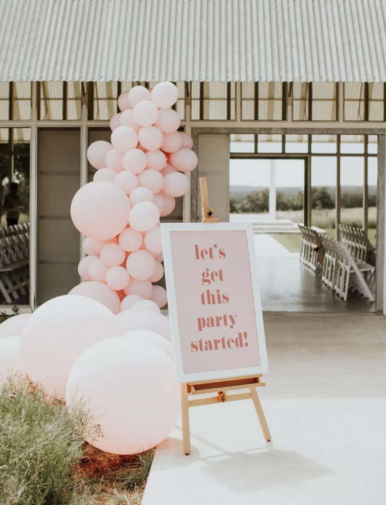 Pink balloon display outside the ceremony area