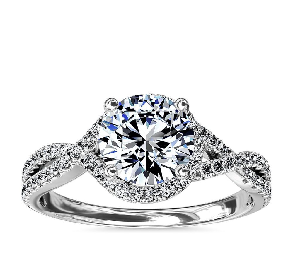 Twisted halo diamond engagement ring