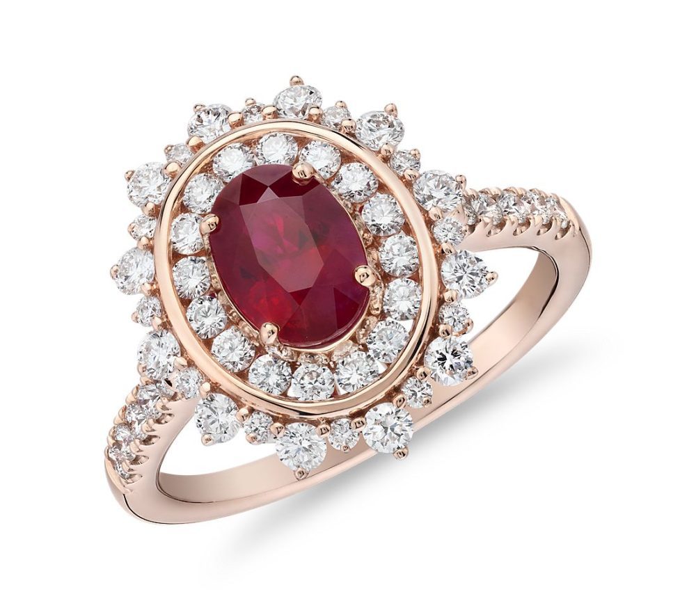 Oval ruby ring with double diamond halo