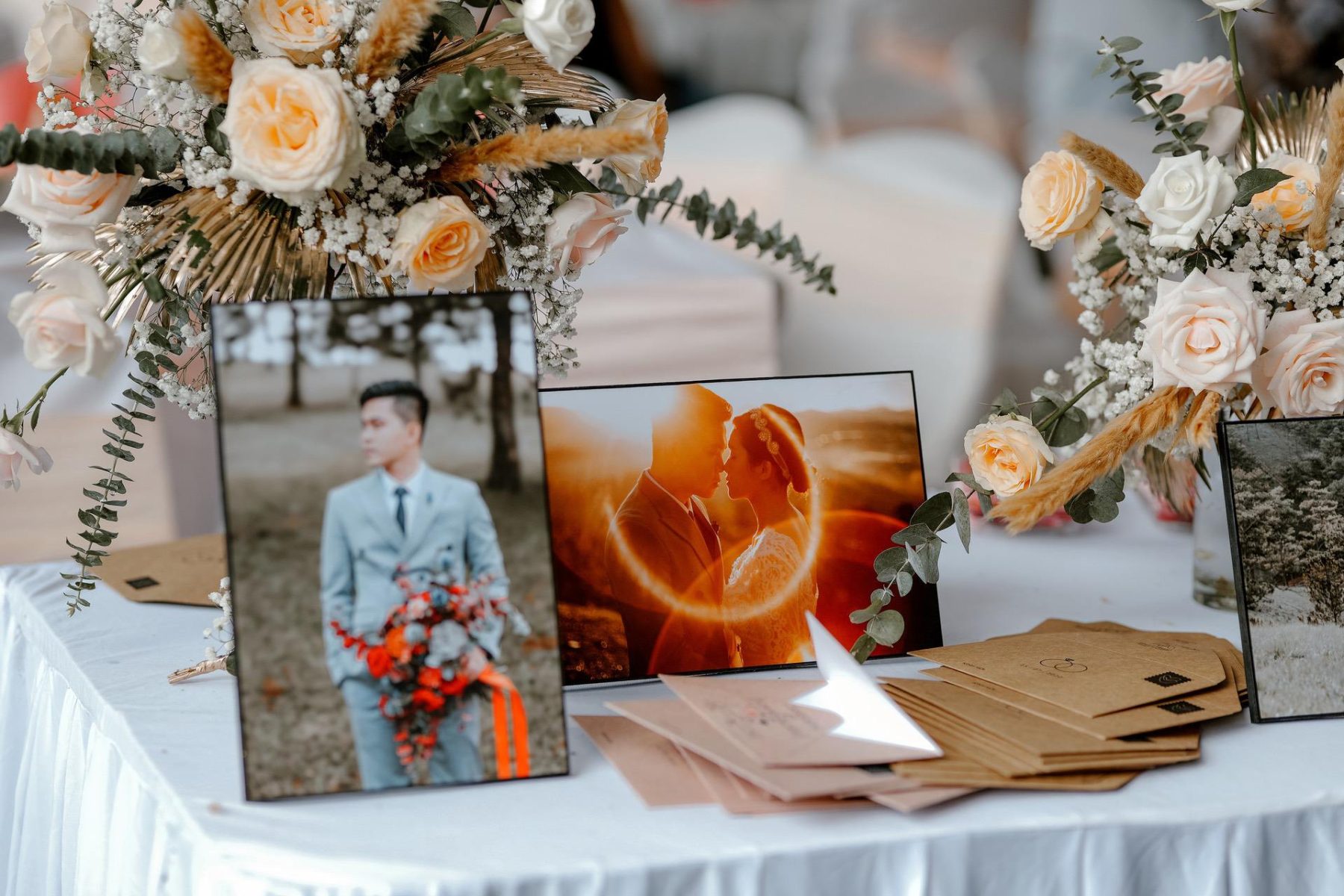 printed wedding photos on a table