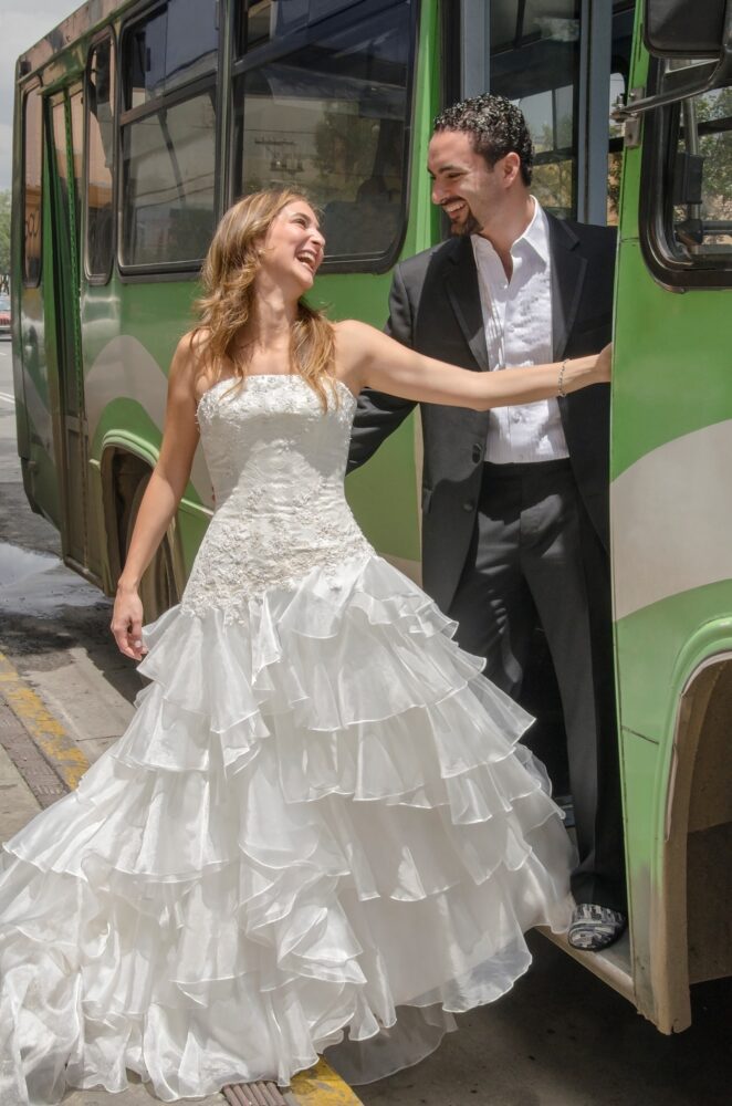 Bride and groom riding a bus