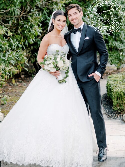 Ashley Iaconetti in Ines Di Santo wedding dress with husband