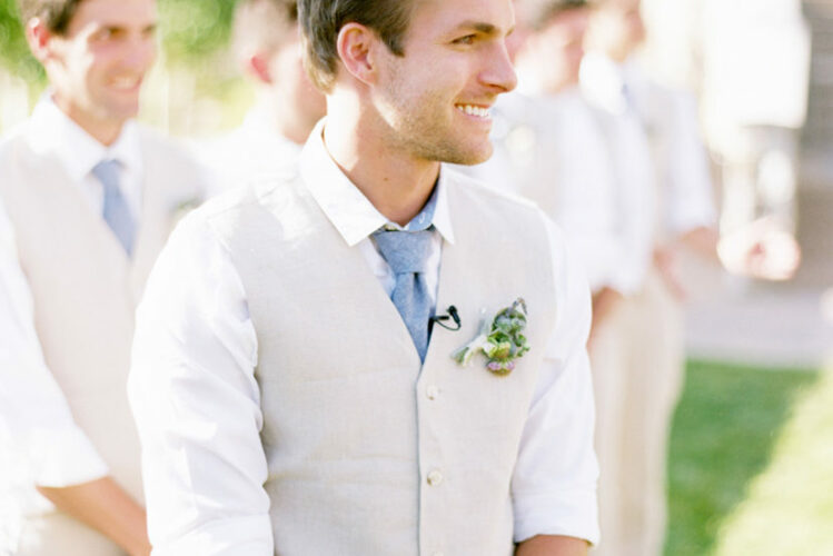 Casual groom in a vest and tie