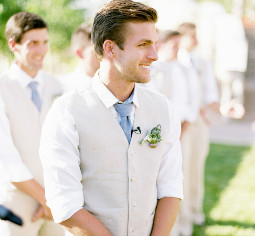 Casual groom in a vest and tie