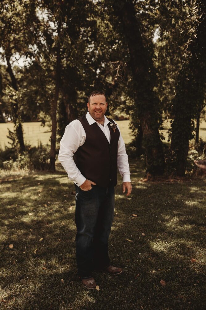 Groom in a vest and jeans