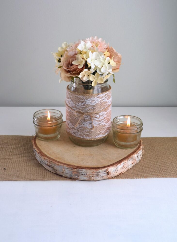 Burlap and lace wrapped mason jar with flowers