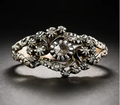 Georgian Period ring, featuring 21 rose-cut diamonds set in silver with an 18k rose-colored gold shank.