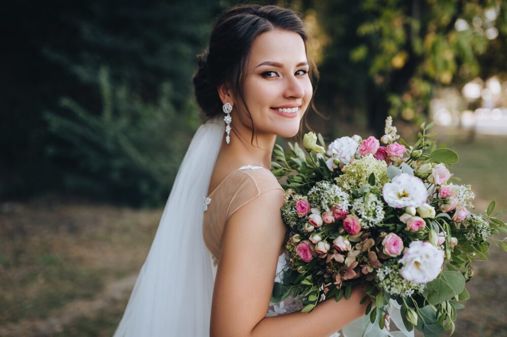 Bride holding a bouquet outside