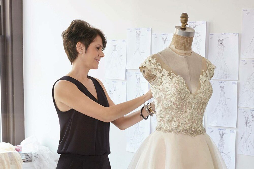 Morilee designer Madeline Gardner working on a bridal gown