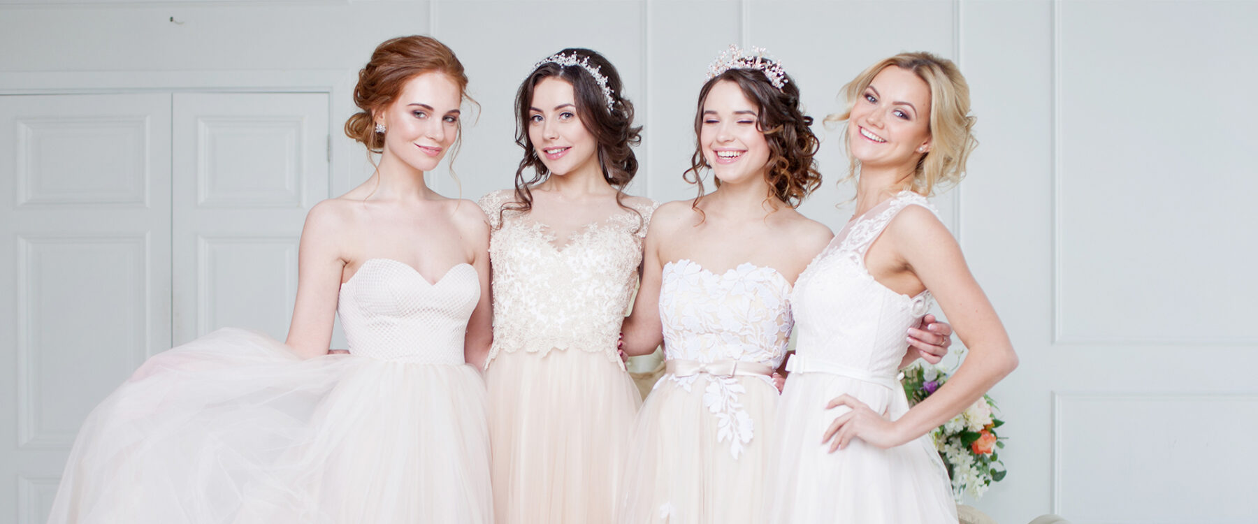 Brides wearing different shades of white wedding dresses