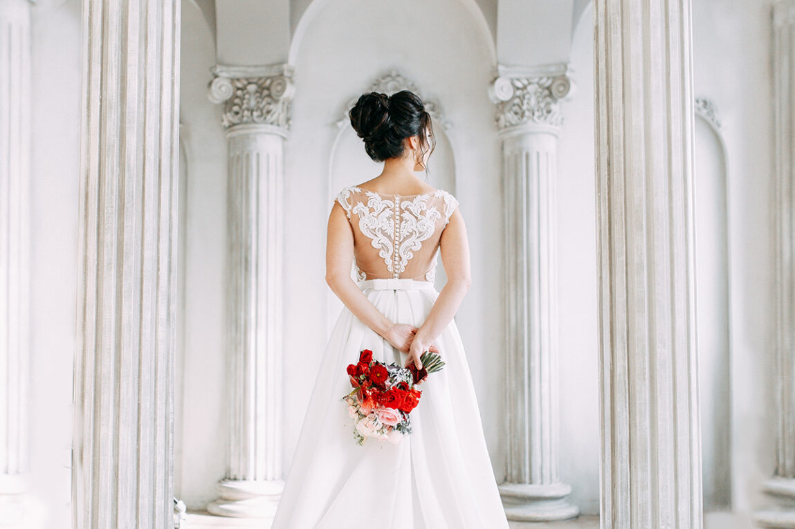 Bride showing off the stunning back of her dress
