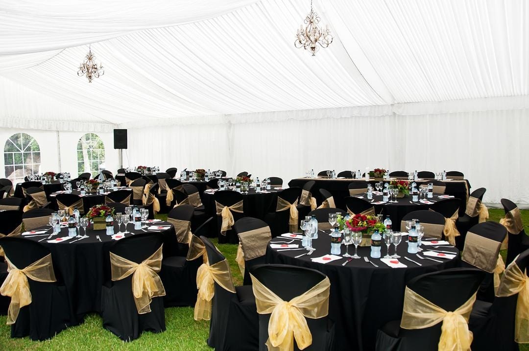 Black chair covers and golden organza sashes