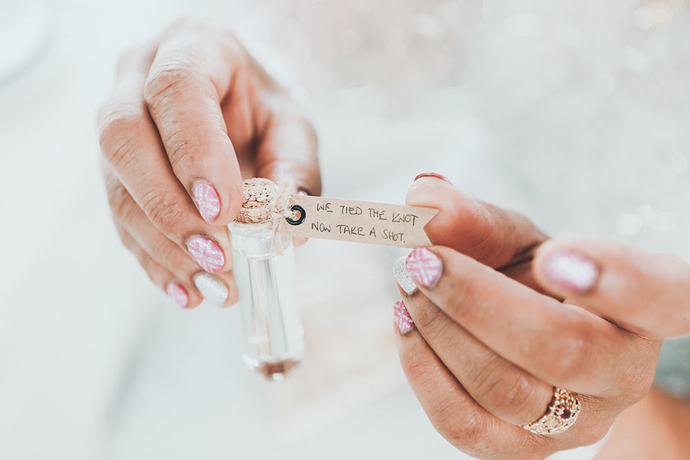 wedding manicure holding romantic note on wedding day
