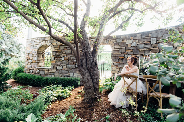A stunning and poetic botanical rhapsody bridal inspiration shoot featuring untamed greenery, a tranquil garden setting and a fairy tale gown by Ali and Batoul Photography