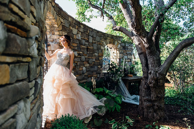 A stunning and poetic botanical rhapsody bridal inspiration shoot featuring untamed greenery, a tranquil garden setting and a fairy tale gown by Ali and Batoul Photography