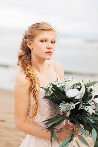 A bridal inspiration shoot on Cape Kiwanda Beach with a siren of the sea theme by Ava Maria Photography