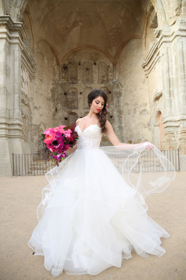 A bold fuchsia look for the bride and groom at the San Juan Capistrano Mission by Chloe Atnip Photography