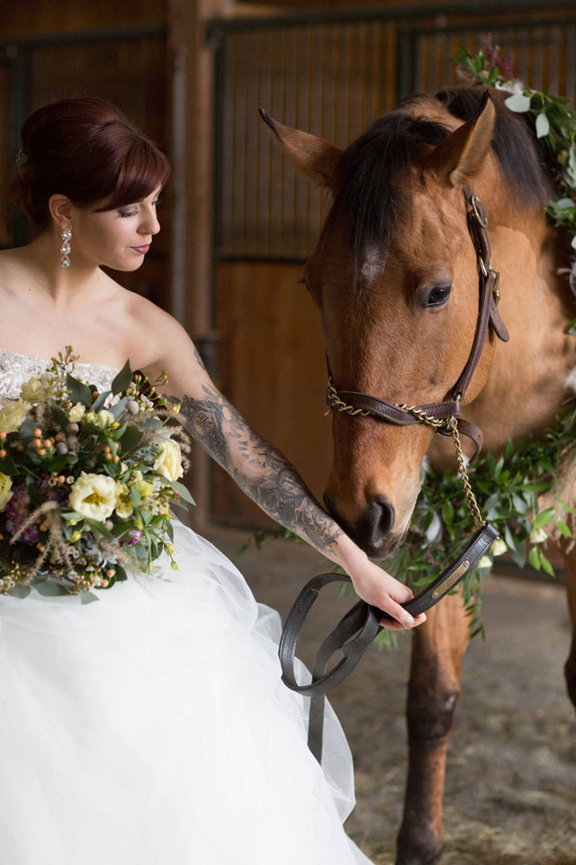 Gorgeous snowy white bridal portraits with a horse by Stella Blue Photography