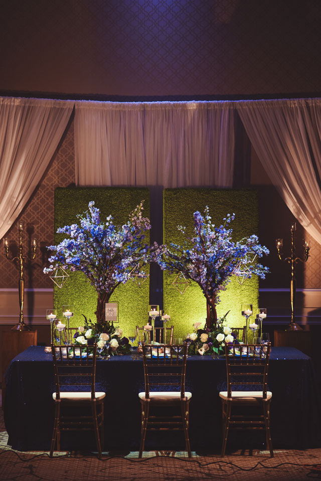 A stunning blue and green wedding inspiration shoot with dramatic lighting by 5 Rivers Studio and Sage Designs