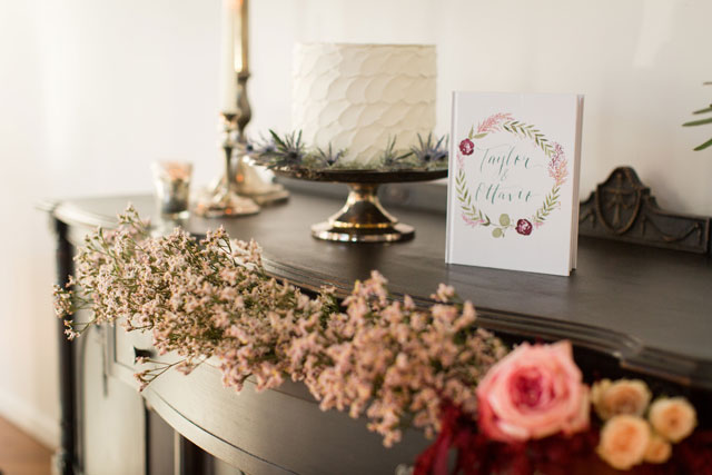 An exquisite dusty blue, burgundy and blush winter wedding styled shoot with lush florals and a romantic sweetheart table by Alexandra Lee Photography
