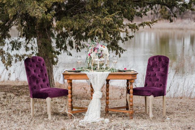 A rustic lakeside wedding inspiration shoot with an Airstream, vintage furniture and a palette of rich reds, purples and gold by Amanda Zabrocki Photography