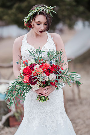 A rustic lakeside wedding inspiration shoot with an Airstream, vintage furniture and a palette of rich reds, purples and gold by Amanda Zabrocki Photography