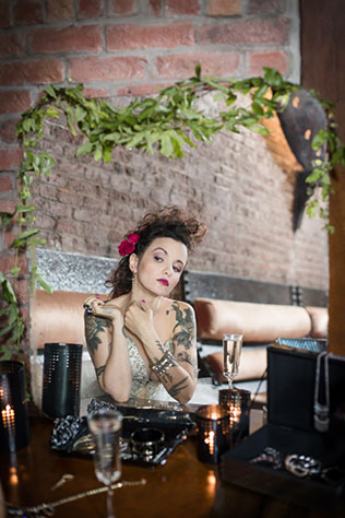 An edgy, provocative and chic same sex styled shoot featuring tattoos, motorcycles and a gold spiked black cake | Amy Sims, Photographer: http://www.amysimsphotographer.com