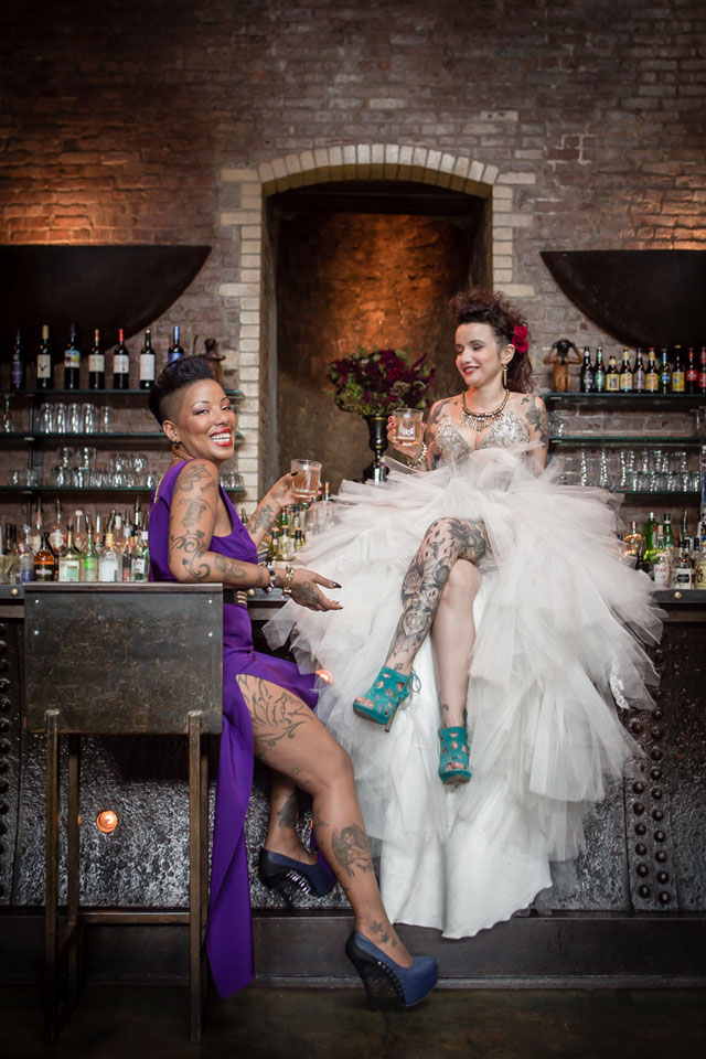 An edgy, provocative and chic same sex styled shoot featuring tattoos, motorcycles and a gold spiked black cake | Amy Sims, Photographer: http://www.amysimsphotographer.com