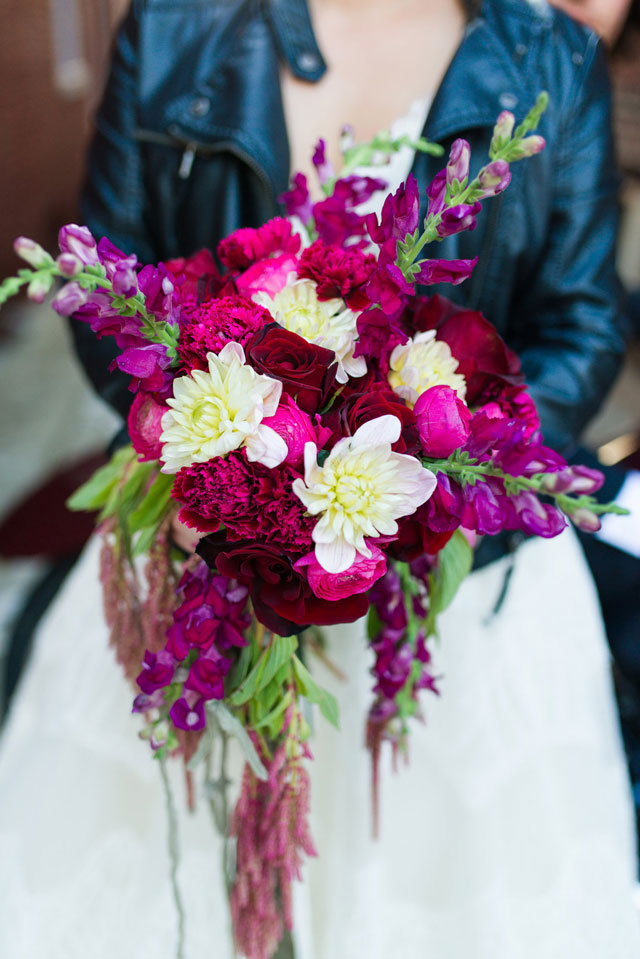 A bold and beautiful Charm in the City wedding inspiration shoot with a vibrant palette of red, gold and black with pops of pink by Ashton Kelley Photography