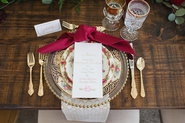 A gorgeous and romantic Beauty and the Beast wedding inspiration shoot with an enchanting tablescape and a fabulous palette of rich reds, deep blues and gold, by Barbara Covington Photography and Like the Dazzling Weddings