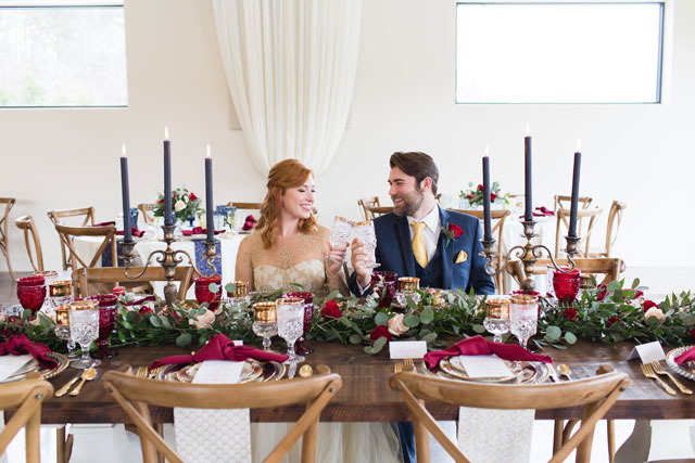A gorgeous and romantic Beauty and the Beast wedding inspiration shoot with an enchanting tablescape and a fabulous palette of rich reds, deep blues and gold, by Barbara Covington Photography and Like the Dazzling Weddings