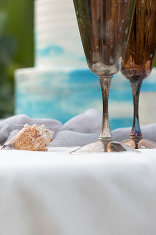 A coastal wedding inspiration shoot featuring seashells, greenery and watercolor details by Diana Bello Studio LLC
