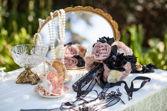 A luxurious and feminine Victorian wedding inspiration shoot with touches of black and gold along with delicate details by Entwined Portraits and Weddings