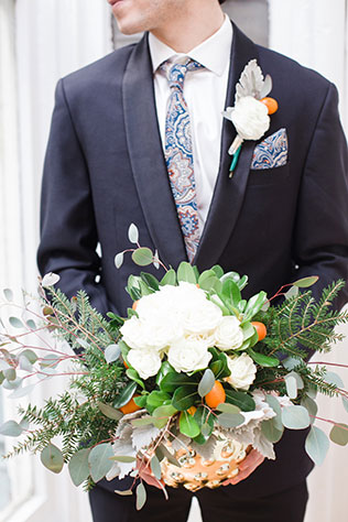 A modern winter wedding inspiration shoot with a palette of soft winter whites and bold pops of citrus and deep winter tones by For the Love Photography