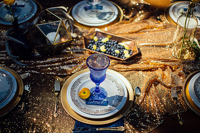 A spectacular celestial inspired styled shoot with a dark, romantic palette of black, gold, deep blue and rich purple by Jessica Manns Photography