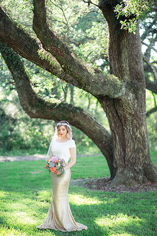 A chic boho watercolor wedding styled shoot in Texas with vibrant florals and a gold two-piece wedding dress by Jessica Pledger Photography