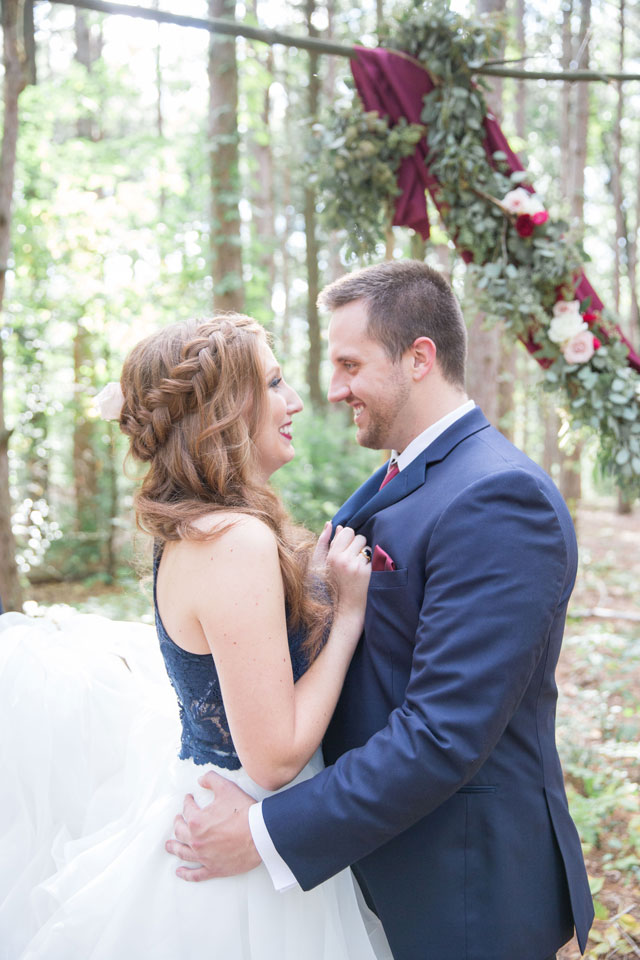 A wooded wedding inspiration shoot in Michigan with a bold yet classic palette of navy blue and rich merlot by Lisa Hammond Photography