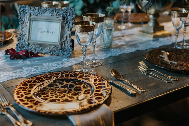 A moody, luxe wedding styled shoot at an artist's atelier in a historic Wisconsin barn by Lisa Kathan Photography and The Gilded Aisle