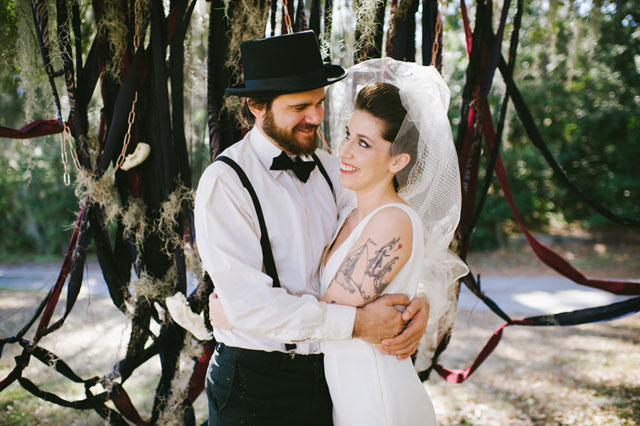 A dark and edgy rock and roll wedding styled shoot with skulls and snakes // photo by Rach Lea Photography: http://www.rachleaphoto.com || see more on https://blog.nearlynewlywed.com