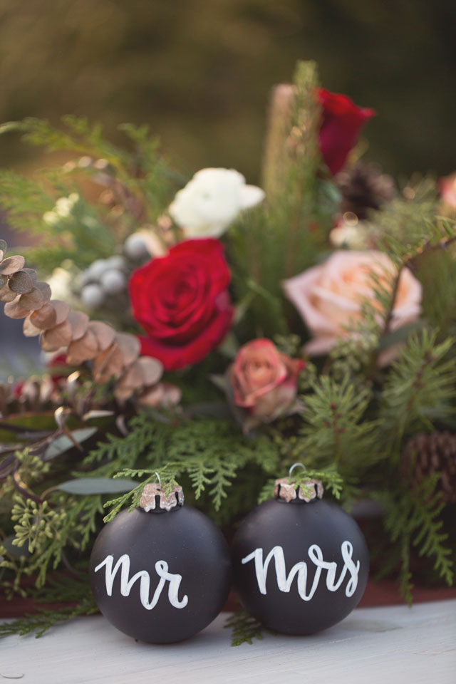 A Christmas wedding inspiration shoot with vintage details, a traditional palette of red and green, and signage with calligraphy by Shelby Photography