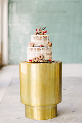 An industrial harvest styled shoot with rich fall tones, an A-frame arch and a 1942 Packard convertible by Stefanie Russo Photography