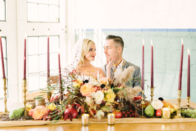 An industrial harvest styled shoot with rich fall tones, an A-frame arch and a 1942 Packard convertible by Stefanie Russo Photography