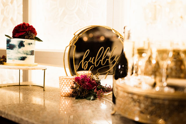 Blending all things boho, bold and moody tones, this wedding inspiration shoot features a floral shrug, a luxe tablescape and more by Tandem Tree Photography and Acowsay Cinema