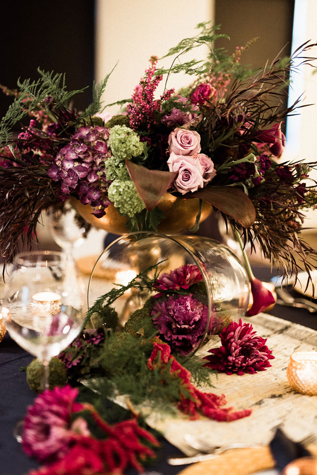 Blending all things boho, bold and moody tones, this wedding inspiration shoot features a floral shrug, a luxe tablescape and more by Tandem Tree Photography and Acowsay Cinema
