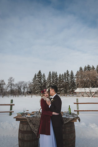 A marsala-hued snowy, dreamy winter wedding inspiration shoot at a rustic ranch by The Winnipeg Wedding Photographers Collective and Melanie Parent Events