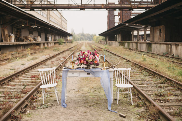 An intimate railway elopement inspiration shoot in Prague with a vintage lace dress and a bold rose crown by Yana Zolotoverkhaya