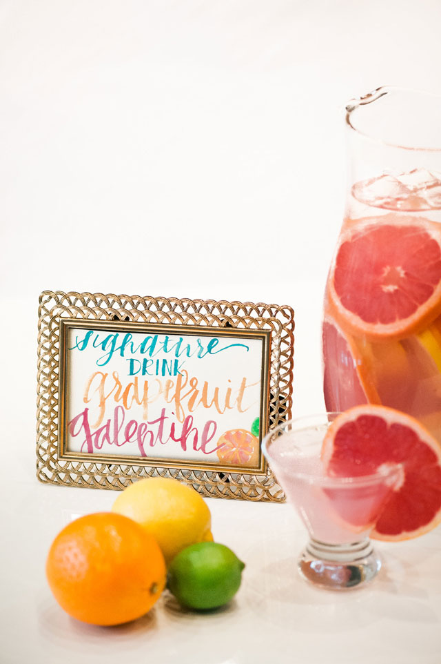 A vibrant and modern citrus-hued Galentine's Day dinner party with a signature cocktail by Choice Jade Photography and Saving Grace Occasions